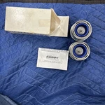 Pair Of 2.441" Hub Bore Stainless Steel Dexter Trailer Wheel Bearing Protectors. Fixed Price $40.00.